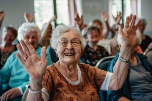 A cozy assisted living apartment with family photos, a quilted throw, and a potted plant on a sunny windowsill.